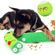 Green crocheted cactus dog snuffle toy roll with red mouth, used with treats.
