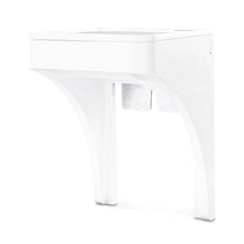 White outlet shelf with open cord storage area visible under the tabletop
