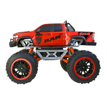 Red RC monster truck side view with roll cage, orange shocks, and oversized tires