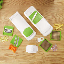 Multi-function mandoline slicer with green inserts and white body, plus slicing blade set