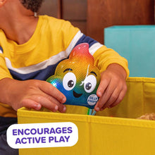 Kids hide-and-seek poop character toy in rainbow colors being held by a child
