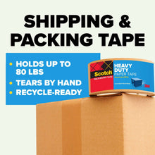 Heavy duty paper tape roll next to a shipping box on a packing surface