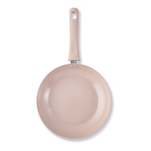Blush pink ceramic non-stick fry pan with handle loop, underside view