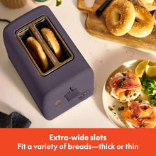 Plum 2-slice toaster with wide slots and toasting carriage, with bagels pictured