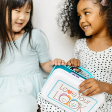 Children playing with a blue pretend makeup case with mirror and Love Your Look panel