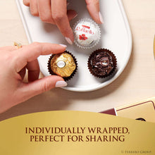 Individually wrapped Ferrero chocolates on a plate with hands placing a piece