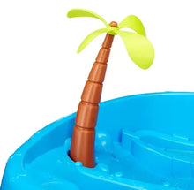 Palm tree water spout on a blue kids water table toy
