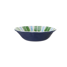 Melamine serving bowl with green striped rim and deep blue base