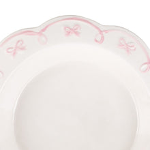 Ballet pink ribbon bow pattern on scalloped rim of pie dish