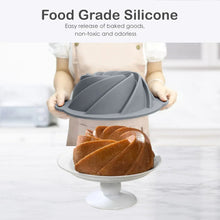 Silicone bundt cake pan with spiral ridges and side grips, dark gray