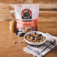 Protein granola bag with serving bowl of cookie butter granola and blueberries