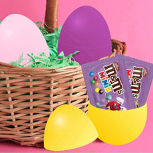 Yellow egg-shaped candies and purple M&M's Minis candy packets in an Easter basket