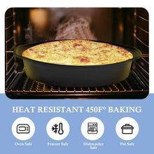 Black round cake pan with baked cake in an oven on the rack