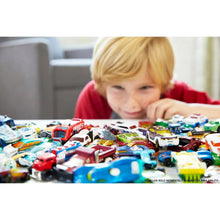 1:64 toy car set of 8 cars and trucks with child reaching across mixed cars