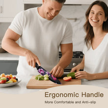 Floral-blade kitchen knives with black ergonomic handles on a wooden cutting board