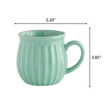 Green stoneware mug, 5.3 in wide and 3.85 in tall
