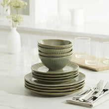Green stoneware bowls and plates stacked, service for 4 tableware set