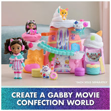 Pastel mountain playset toy with two character figures and colorful candy buildings