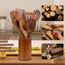 Wooden cooking utensil set in cylindrical holder, assorted spoon and slotted heads.