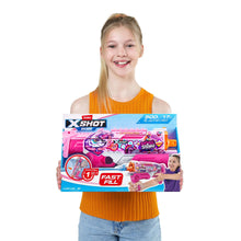 Girl holding XSHOT water blaster skins box with pink blaster and orange nozzle graphics