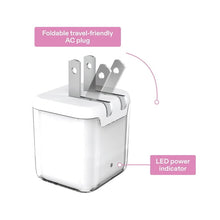 White dual-port wall charger with foldable AC plug and LED power indicator on the front