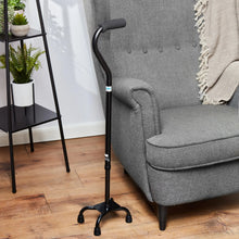 Height-adjustable quad walking cane with cushioned grip and 4-leg rubber base