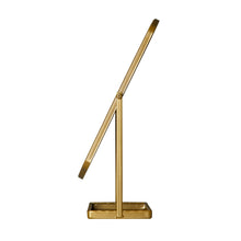 Gold tabletop mirror stand with tall frame and base shelf