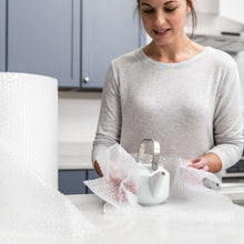 White bubble cushioning wrap around a mug on a table