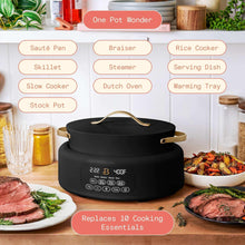 Black multi-cooker pot with lid on kitchen counter, gold-tone handles