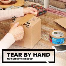 Heavy duty paper packaging tape being applied to a cardboard box by hand
