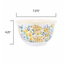 White melamine mixing bowl with blue leaves and yellow flower pattern