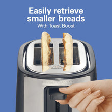 Toaster with bread slots and Toast Boost lever raised