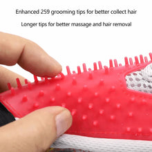 Close-up of red silicone grooming nubs on a pet grooming glove with gray mesh backing