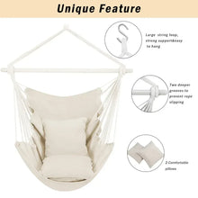Beige hammock chair swing with cushion pads and hanging ropes