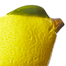 Yellow ceramic lemon bowl with mottled glossy glaze and green leaf detail