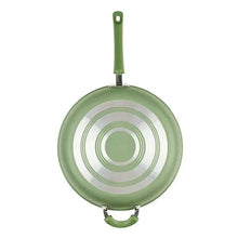 Green nonstick frying pan underside with concentric markings and long handle