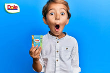 Child holding a Dole mixed berry fruit snack pouch