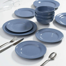 Blue stoneware dinnerware set with dinner plates and serving bowls