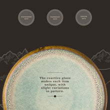 Ceramic dinner plate with seafoam reactive glaze and speckled border