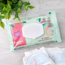 Flushable wipes pack with flip-top lid, teal wrapper and pink Parent's Choice logo