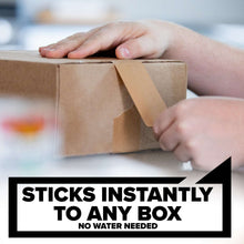 Heavy duty paper tape strip being pressed onto a cardboard box seam