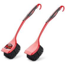 Pair of red scrub brushes with black bristles and angled square cleaning heads