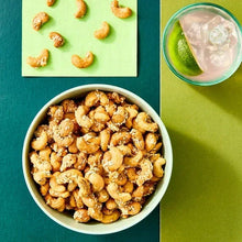Honey sesame cashews in white bowl