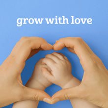 Hands forming a heart shape over a “grow with love” message