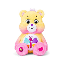 Sitting plush heart bear with yellow fur, pink blush cheeks, and smiling face