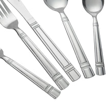 Close view of stainless steel flatware handles and utensil heads