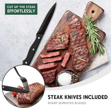 Black steak knives with serrated blades on a cutting board