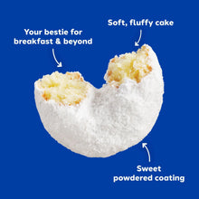 Powdered mini donut with fluffy white coating and soft yellow cake interior