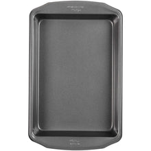 Oblong non-stick brownie pan with dark interior and rounded rim