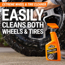 Wheel & tire cleaner spray bottle beside a car wheel and tire